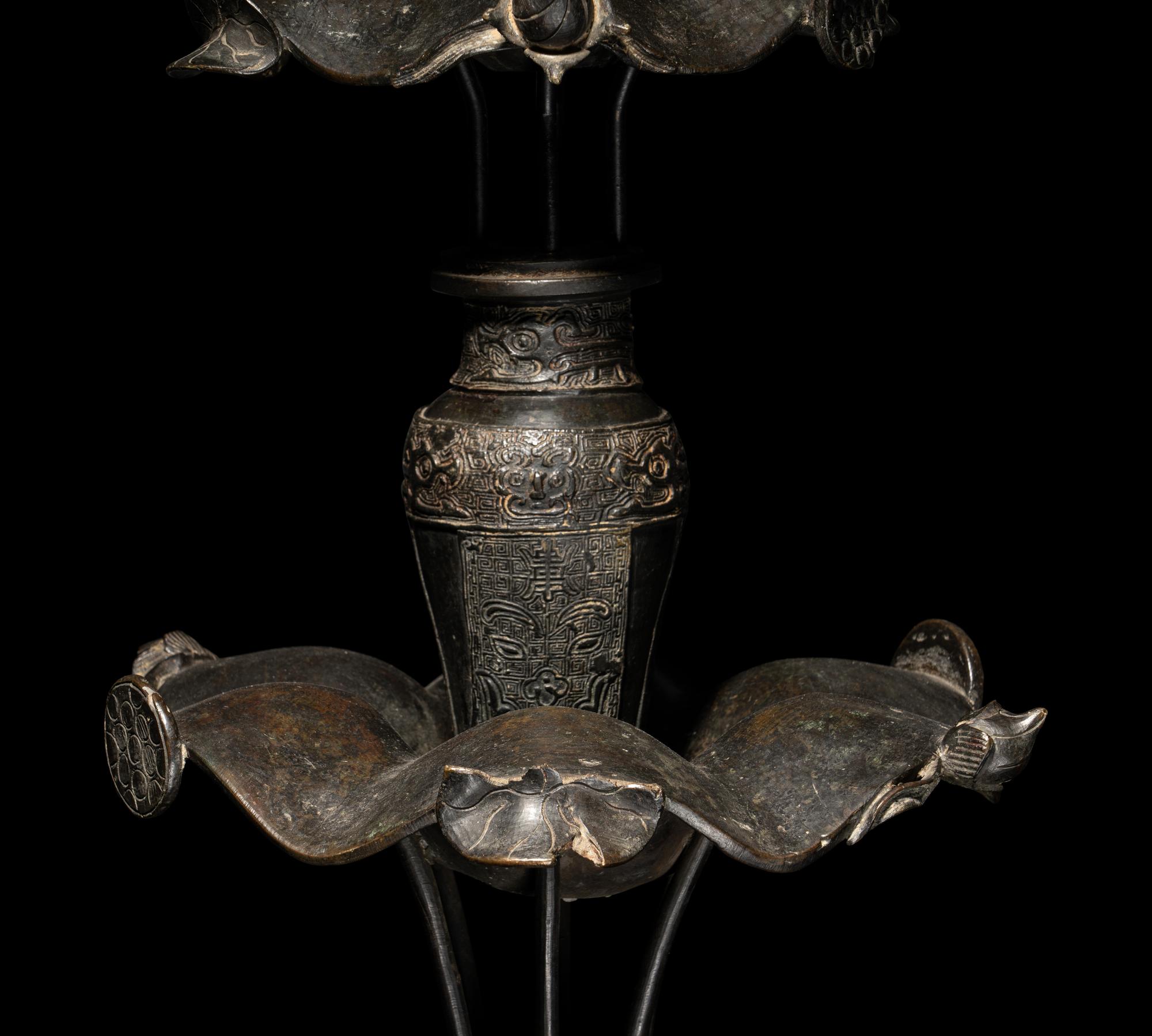 A Large Pair of Bronze Candle Holders