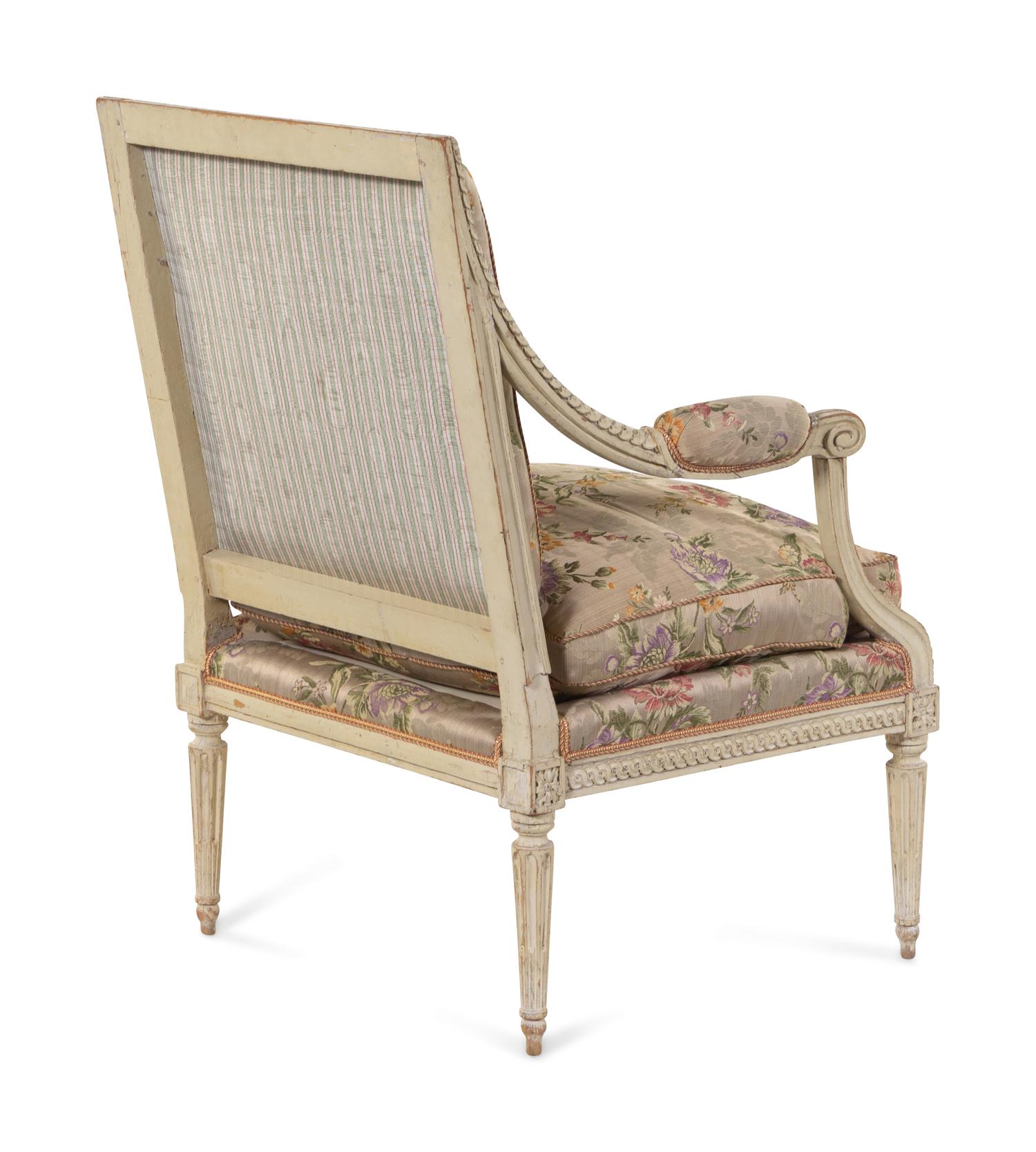 A Louis XVI Carved and White-Painted Fauteuil