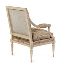 A Louis XVI Carved and White-Painted Fauteuil
