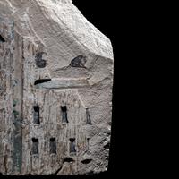 An Egyptian Polychrome Limestone Relief Fragment