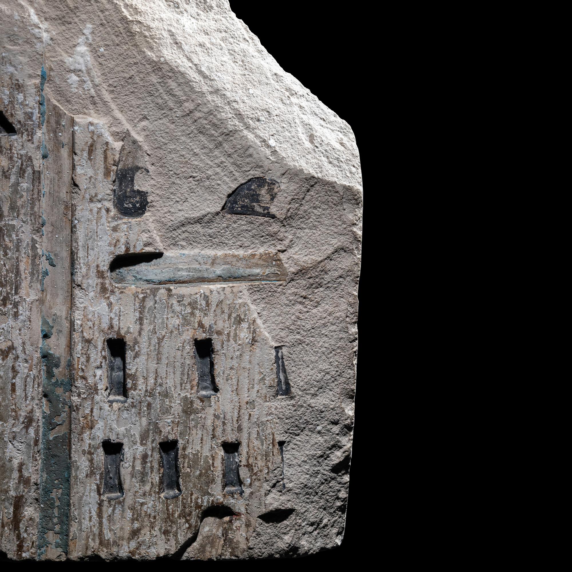 An Egyptian Polychrome Limestone Relief Fragment