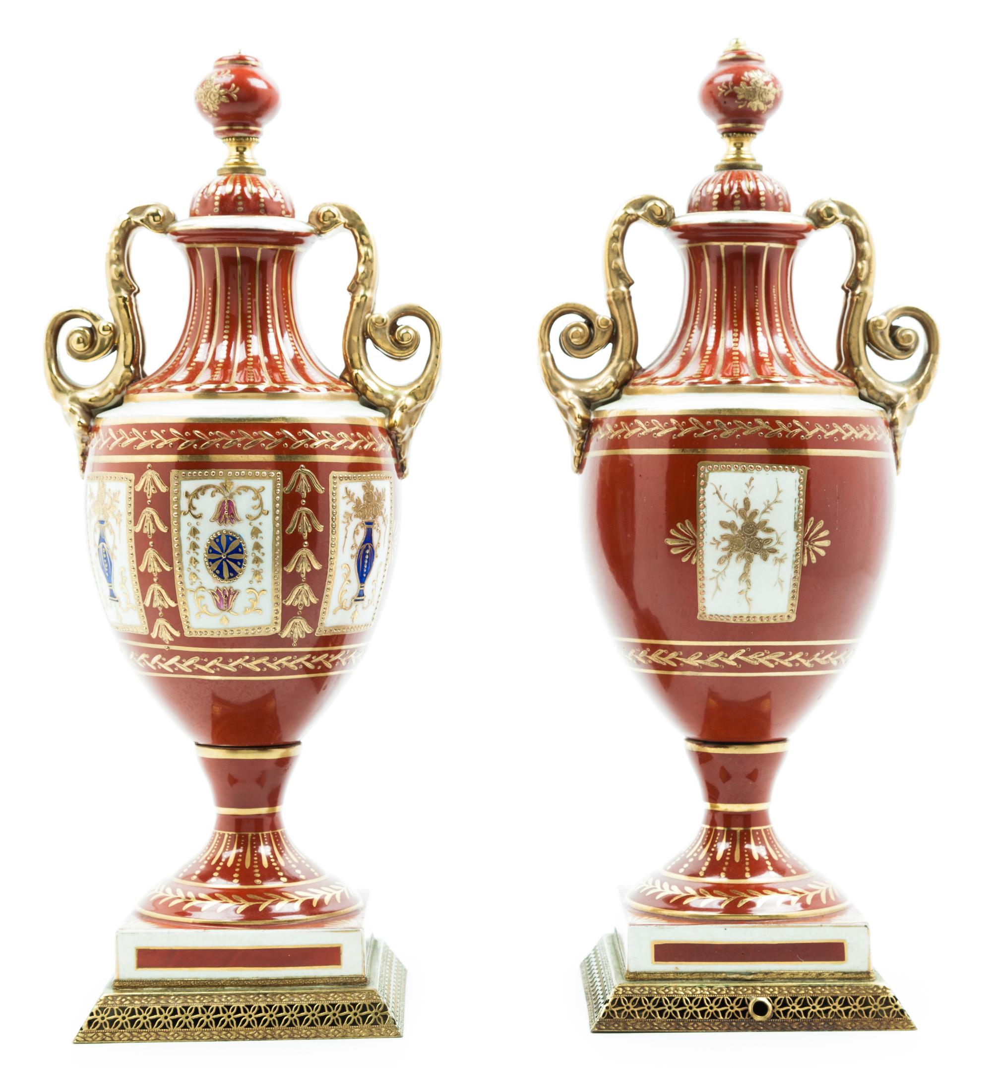 A Pair of Continental Porcelain Urns Height 16 inches.
