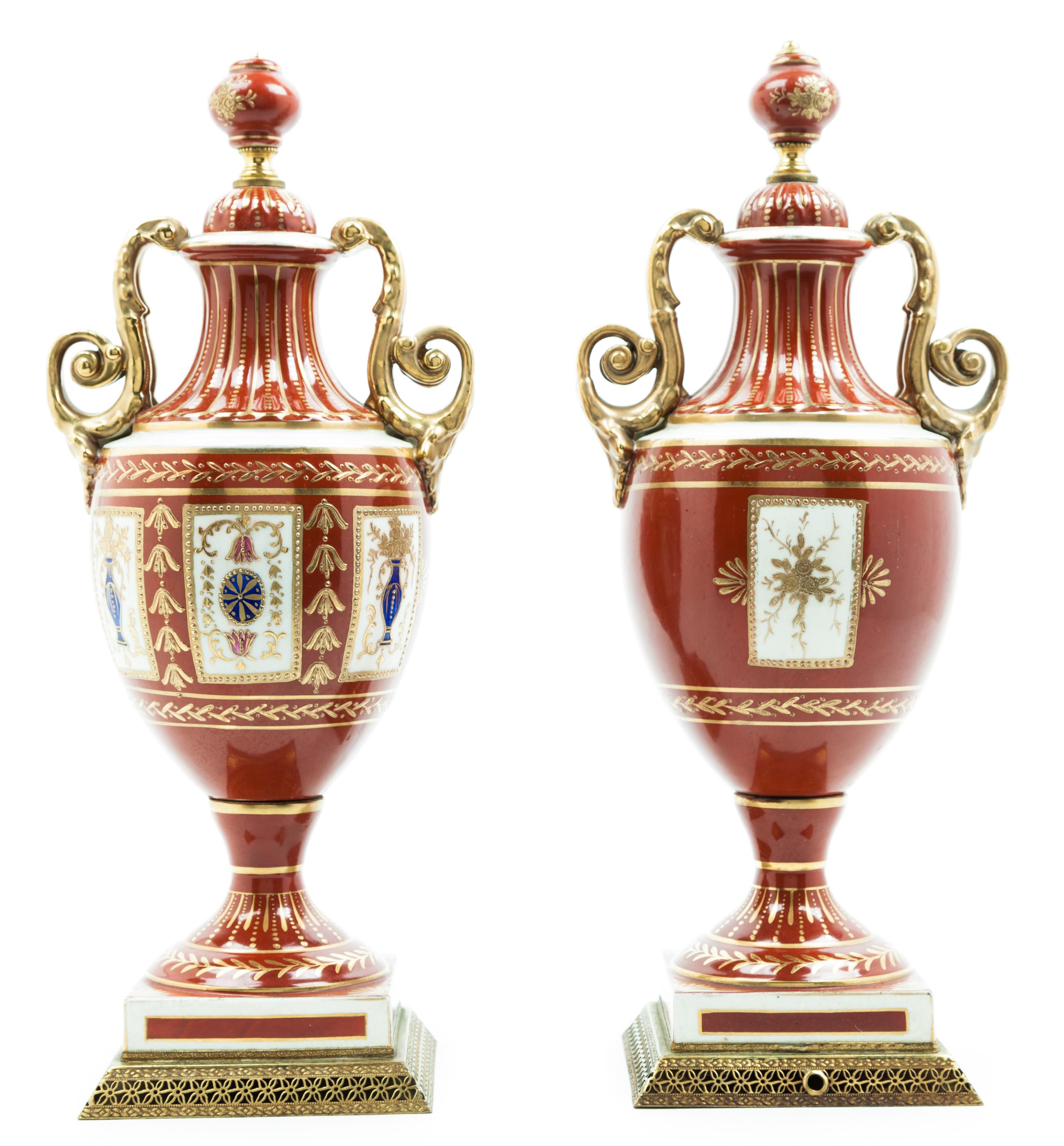 A Pair of Continental Porcelain Urns Height 16 inches.