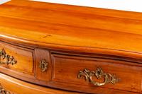 A French Provincial Walnut Bombe Commode