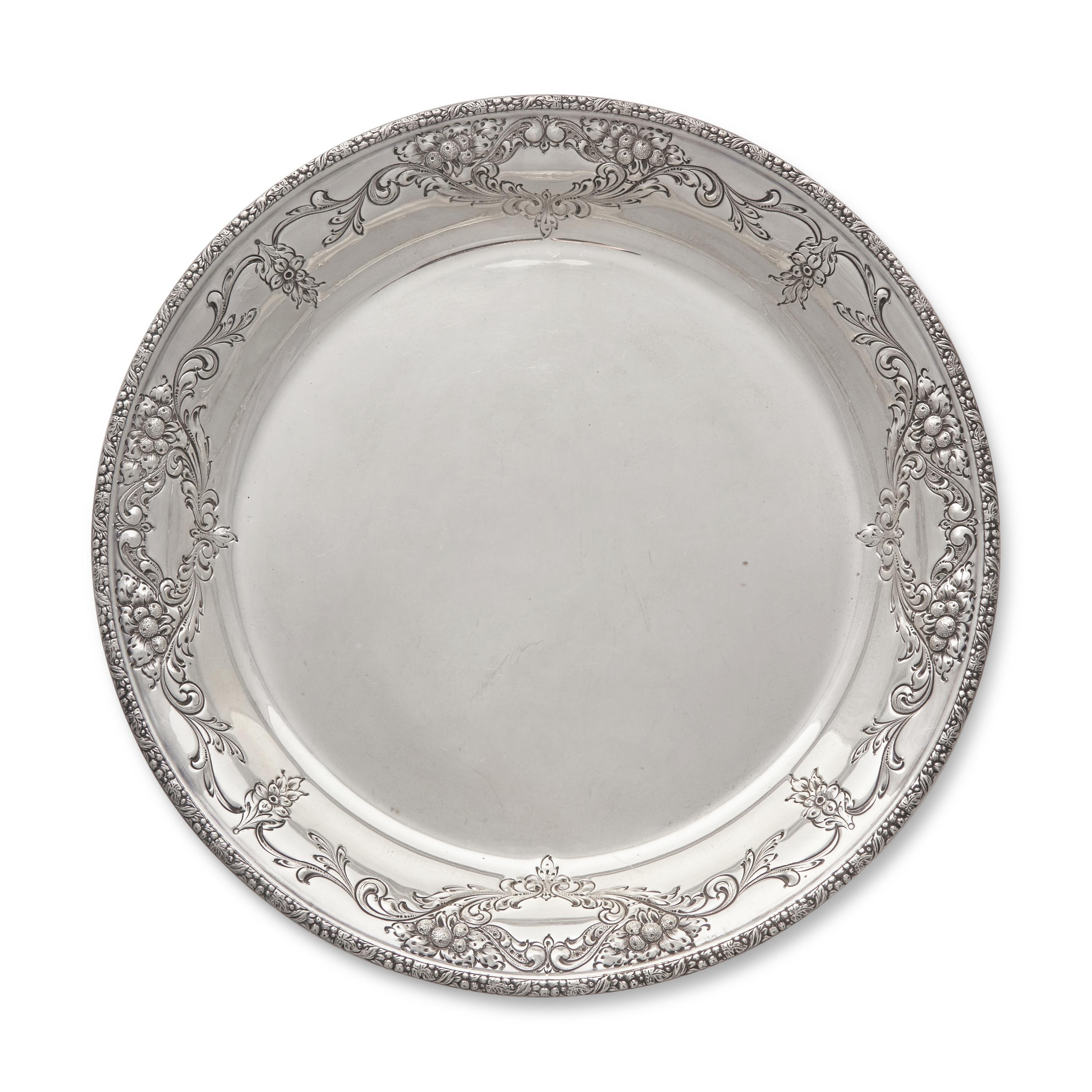 A Sterling Silver Floral Repousse Dished Tray in the Champlain Pattern