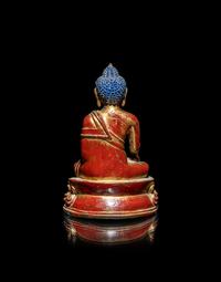 A Tibetan/Nepalese Gilt and Red Lacquered Bronze Figure of Buddha