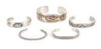 Five Southwestern Silver Bracelets Length of largest 7 1/4 x opening 1 x width 7/8 inches