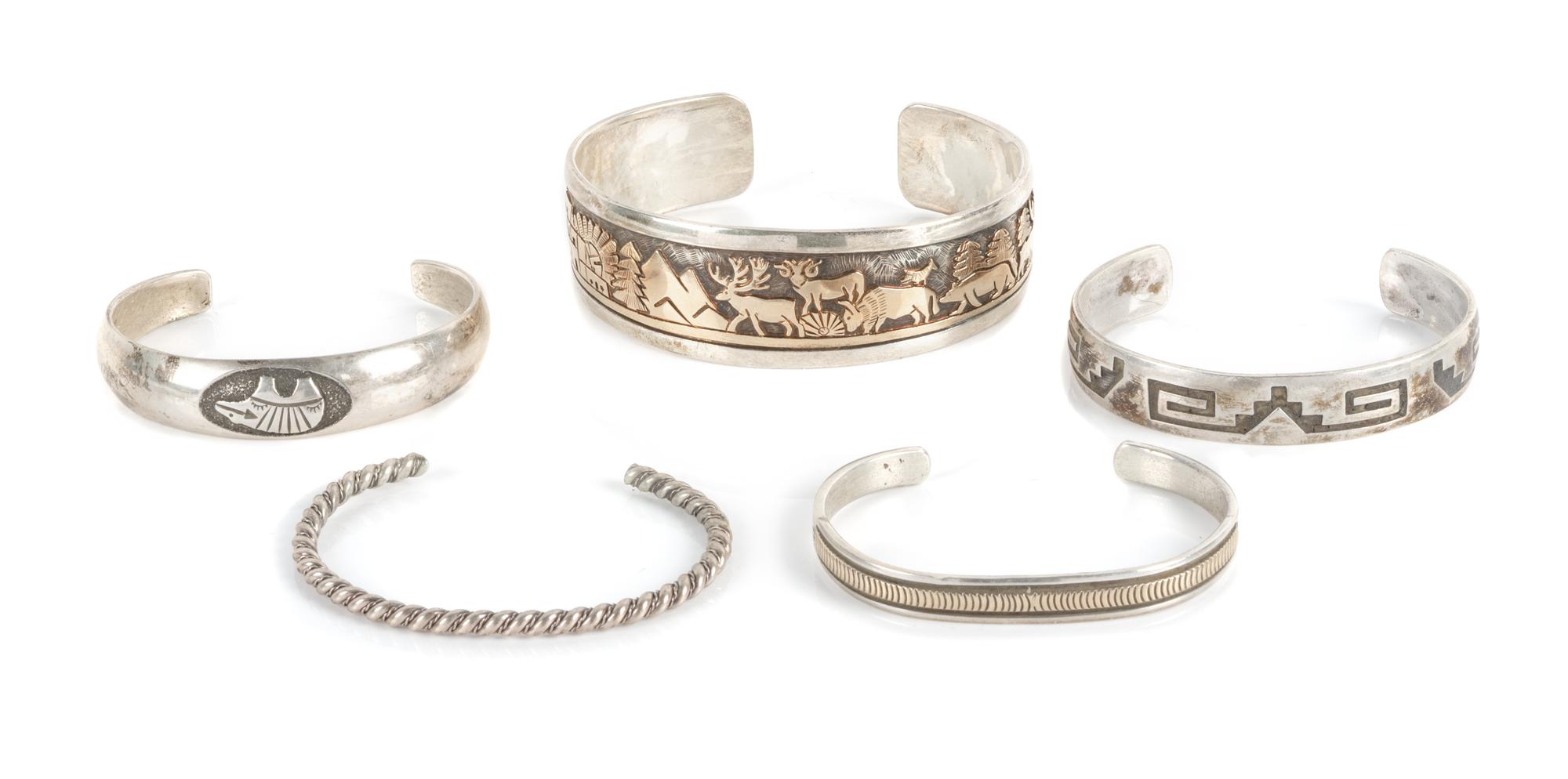 Five Southwestern Silver Bracelets Length of largest 7 1/4 x opening 1 x width 7/8 inches