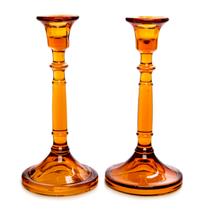 A Pair of Amber Glass Candlesticks Height 8 3/4 inches.