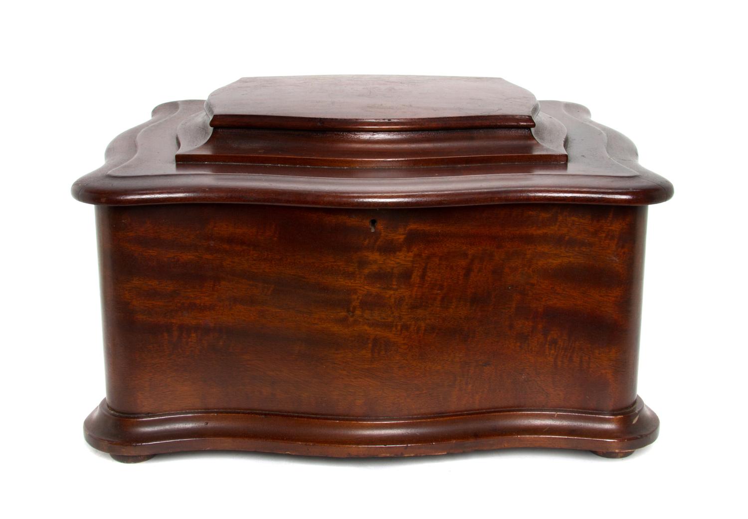 A Regina Mahogany Cased Table Top Disc Music Box, Height 13 x width 23 x depth 20 1/2 inches.