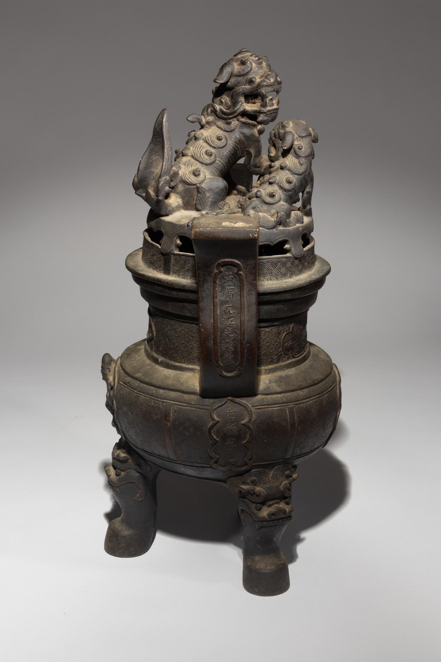 A Bronze Tripod Incense Burner and Cover