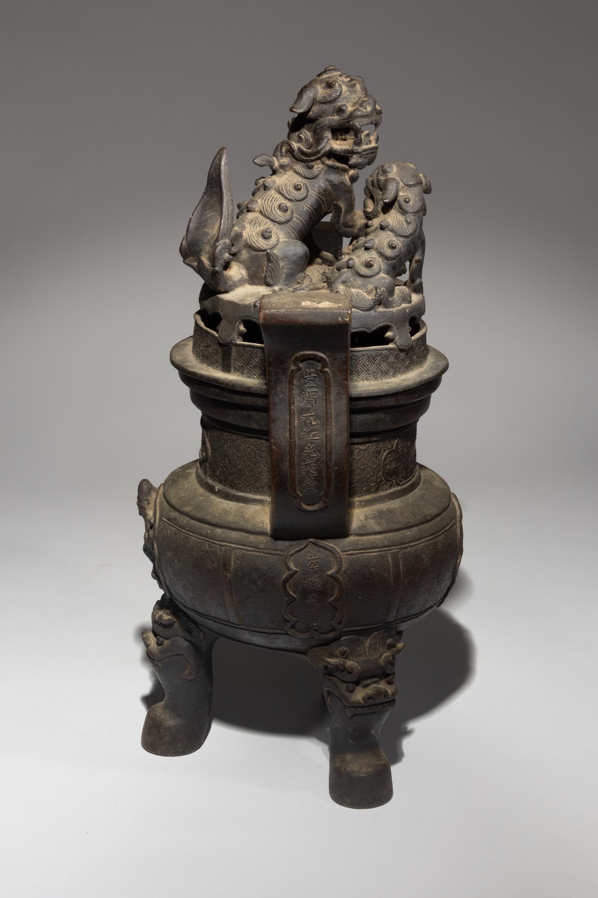 A Bronze Tripod Incense Burner and Cover