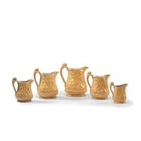 Five Graduated Abolitionist Yellowware Pitchers with Molded Scenes from Uncle Tom's Cabin