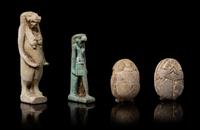 An Egyptian Faience Amulet of Taweret, Two Faience Scarabs and an Egyptian Amulet of Horus Height of tallest 1 5/8 inches. — LATE PERIOD TO PTOLEMAIC PERIOD, 664-30 B.C.E.
