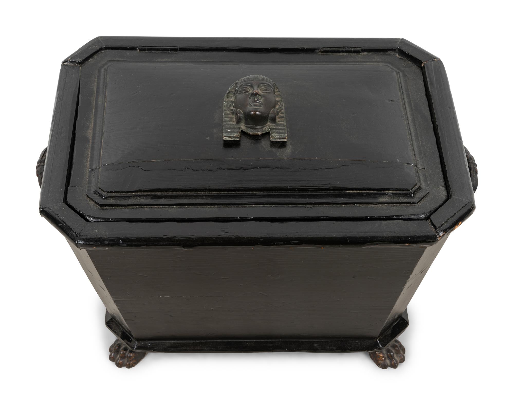 An Egyptian Revival Ebonized Coal Hod