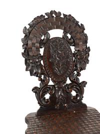 Three Black Forest Carved Side Chairs