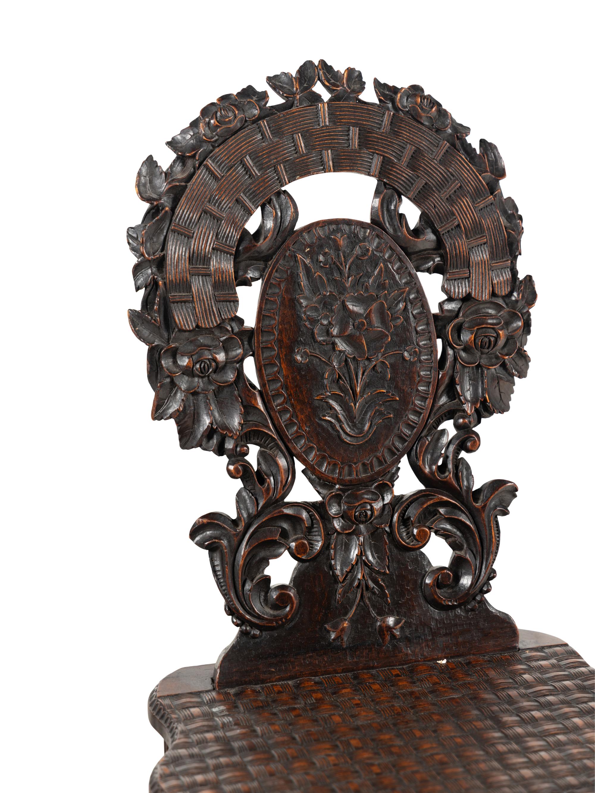 Three Black Forest Carved Side Chairs