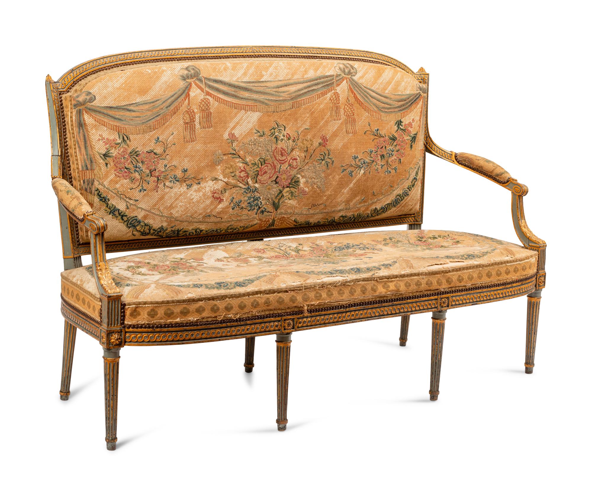A Louis XVI Painted and Parcel Gilt Settee
