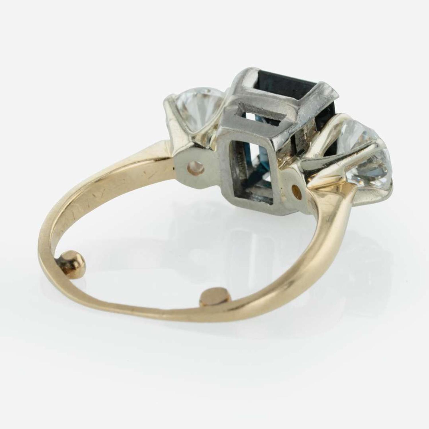 A Three Stone Sapphire and Diamond Ring