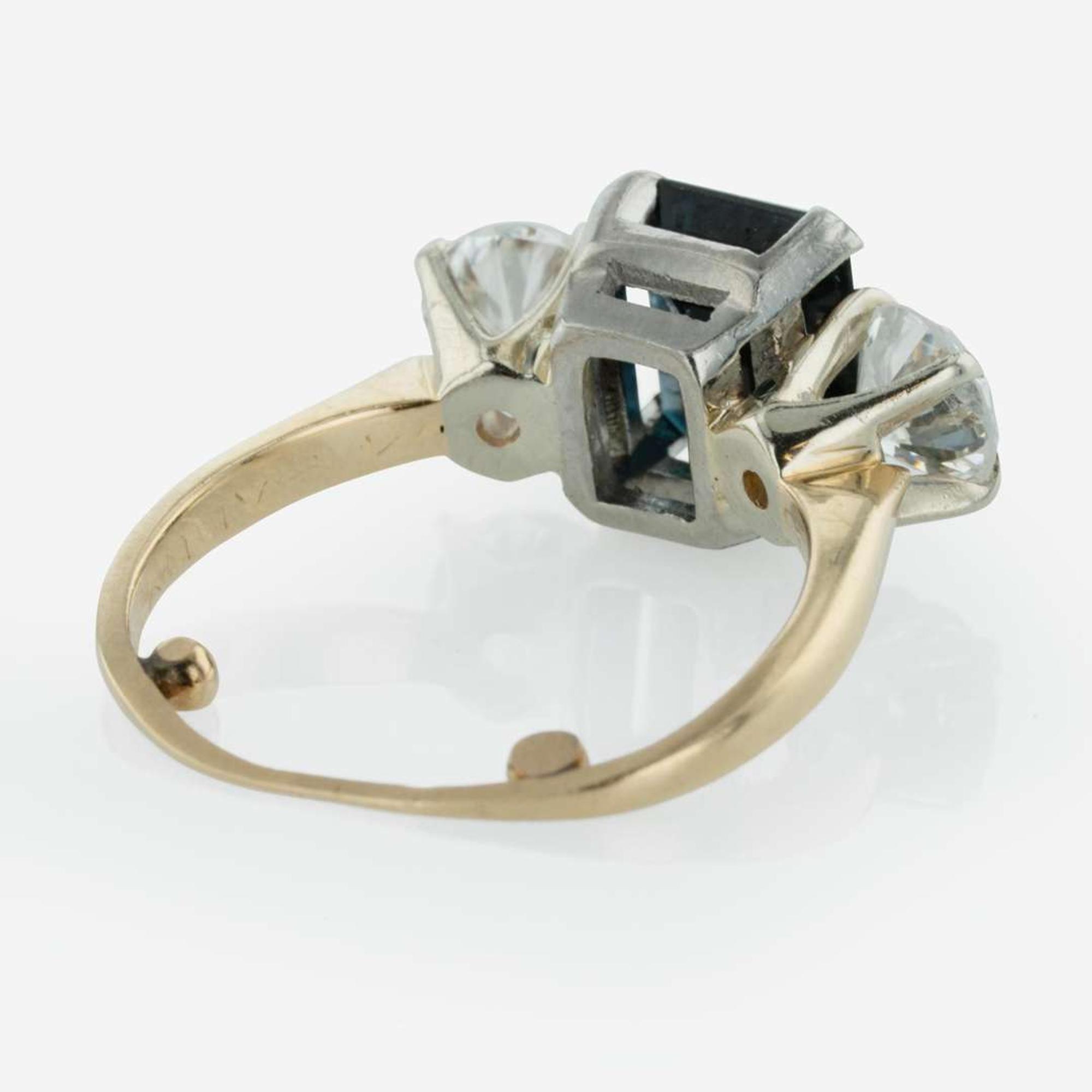 A Three Stone Sapphire and Diamond Ring
