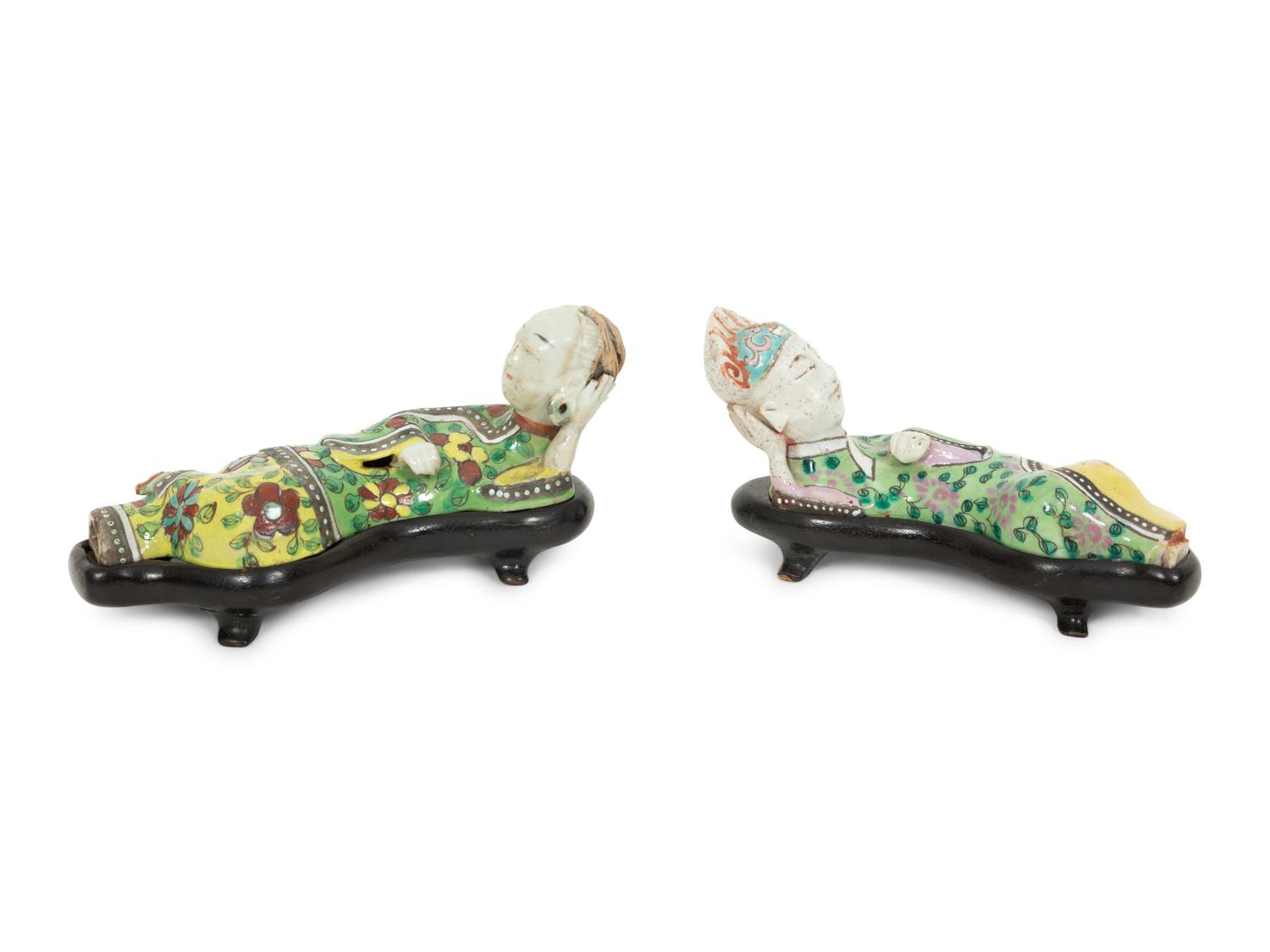 A Pair of Chinese Porcelain Reclining Figures