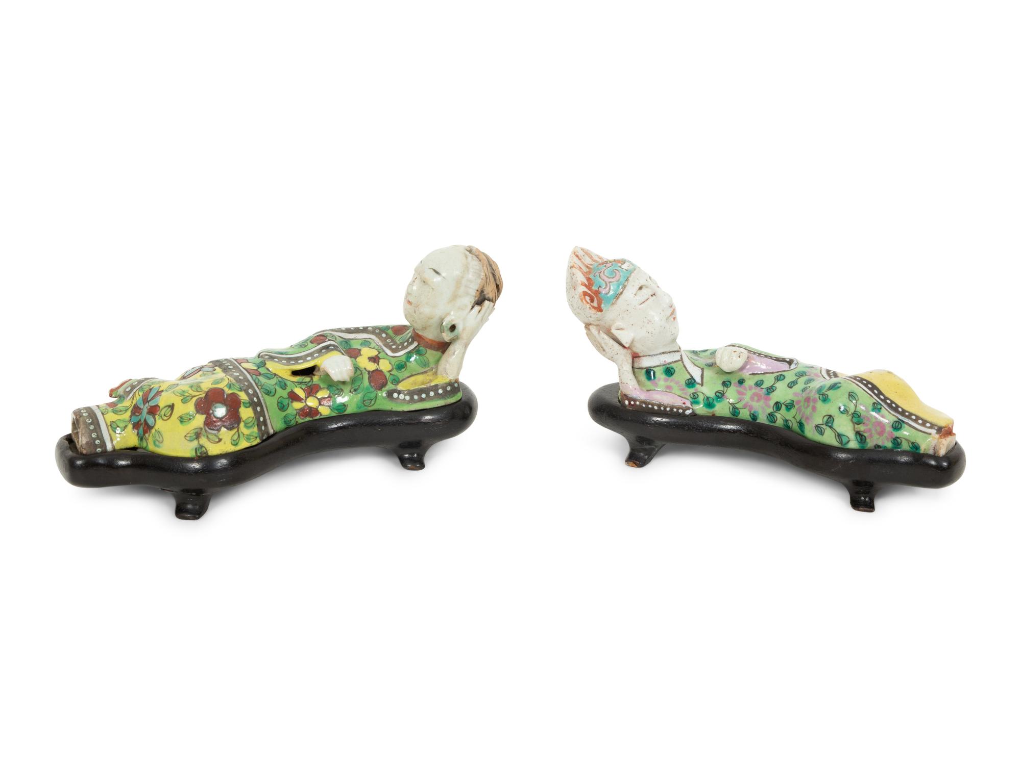A Pair of Chinese Porcelain Reclining Figures
