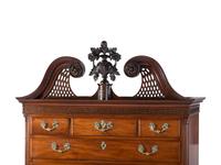 The Holcum Family Chippendale Pierce-Carved and Figured Mahogany Bonnet Top Chest-on-Chest