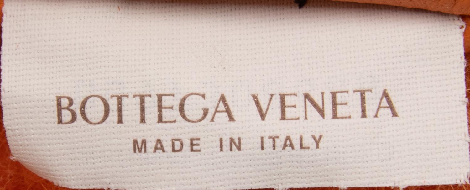BOTTEGA VENETA, MINI JODIE IN ORANGE SHEARLING