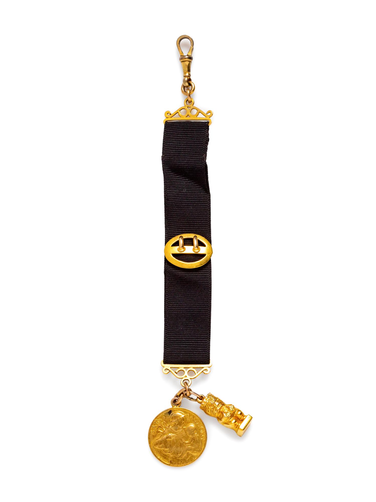 A Yellow Gold Fob with Attached Charms,