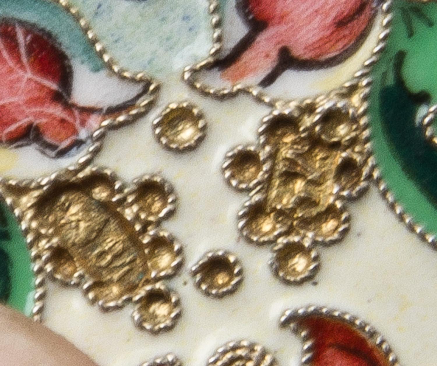 A Russian Enameled Silver Cigarette Case, Mark of M. Chirkov, Moscow, the case with polychrome floral and foliate enamels throughout, w