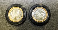 A Pair of Continental Silvered Roundels. Diameter of each 6 5/8 inches.
