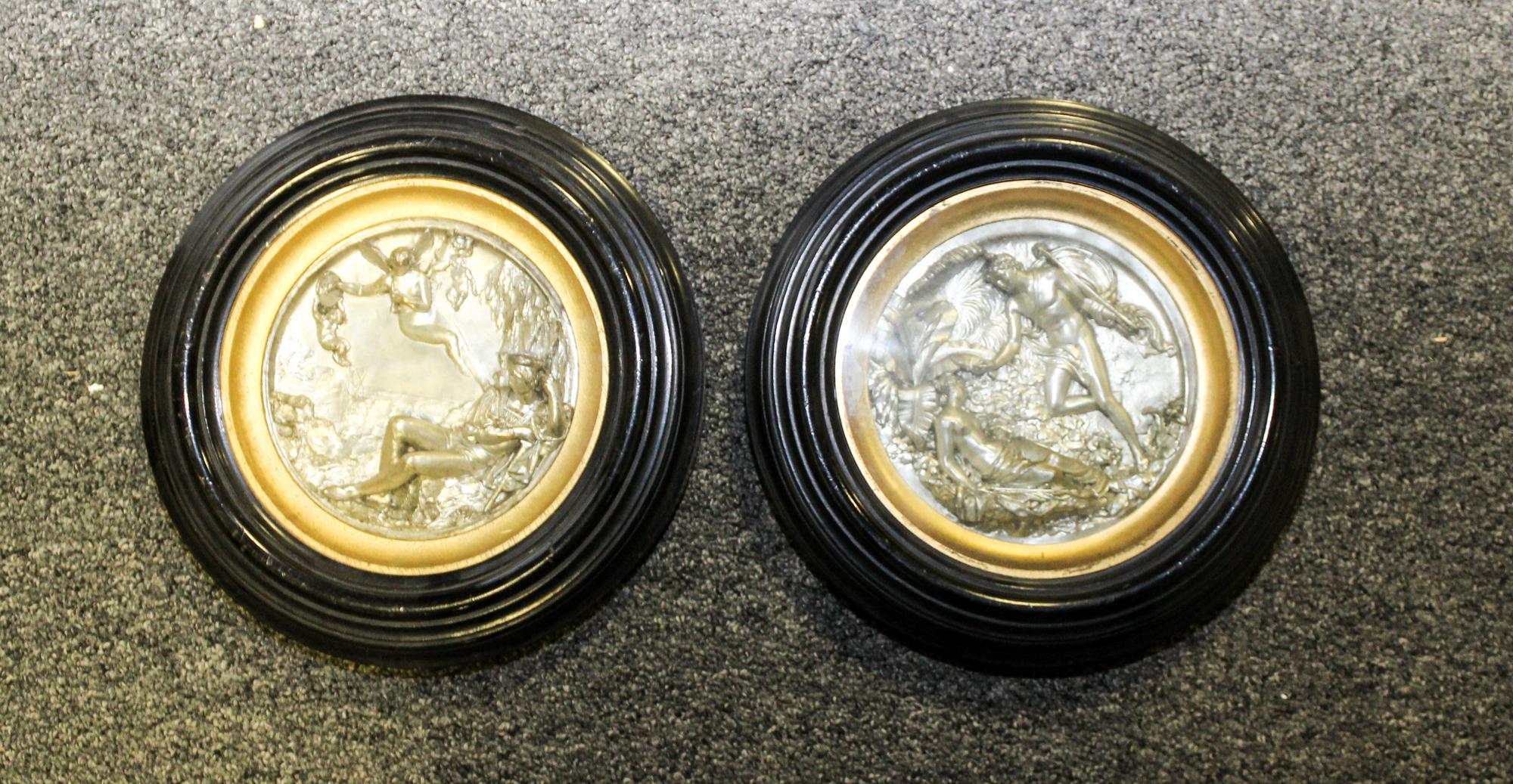 A Pair of Continental Silvered Roundels. Diameter of each 6 5/8 inches.