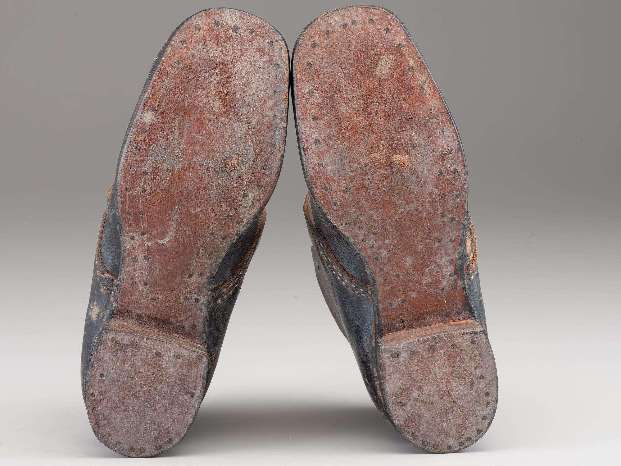 [CIVIL WAR]. A pair of military-issue brogans with a pair of Civil War-period socks.