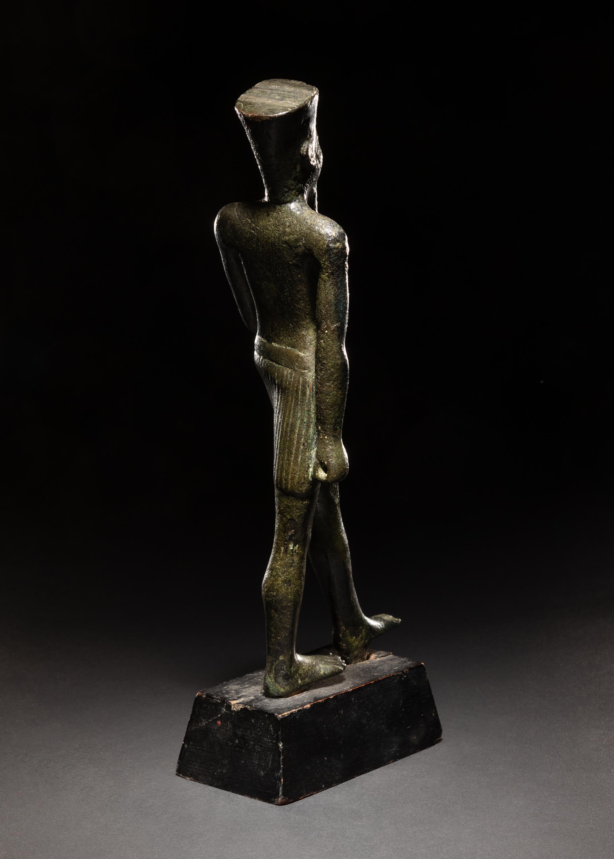 An Egyptian Bronze Figure of Amun