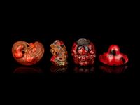 Four Japanese Carved and Red Lacquered Wood Netsuke