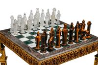 An Empire Style Gilt Bronze Mounted Mahogany and Marble-Top Game Table with a Rock Crystal and Tiger's Eye Chess Set