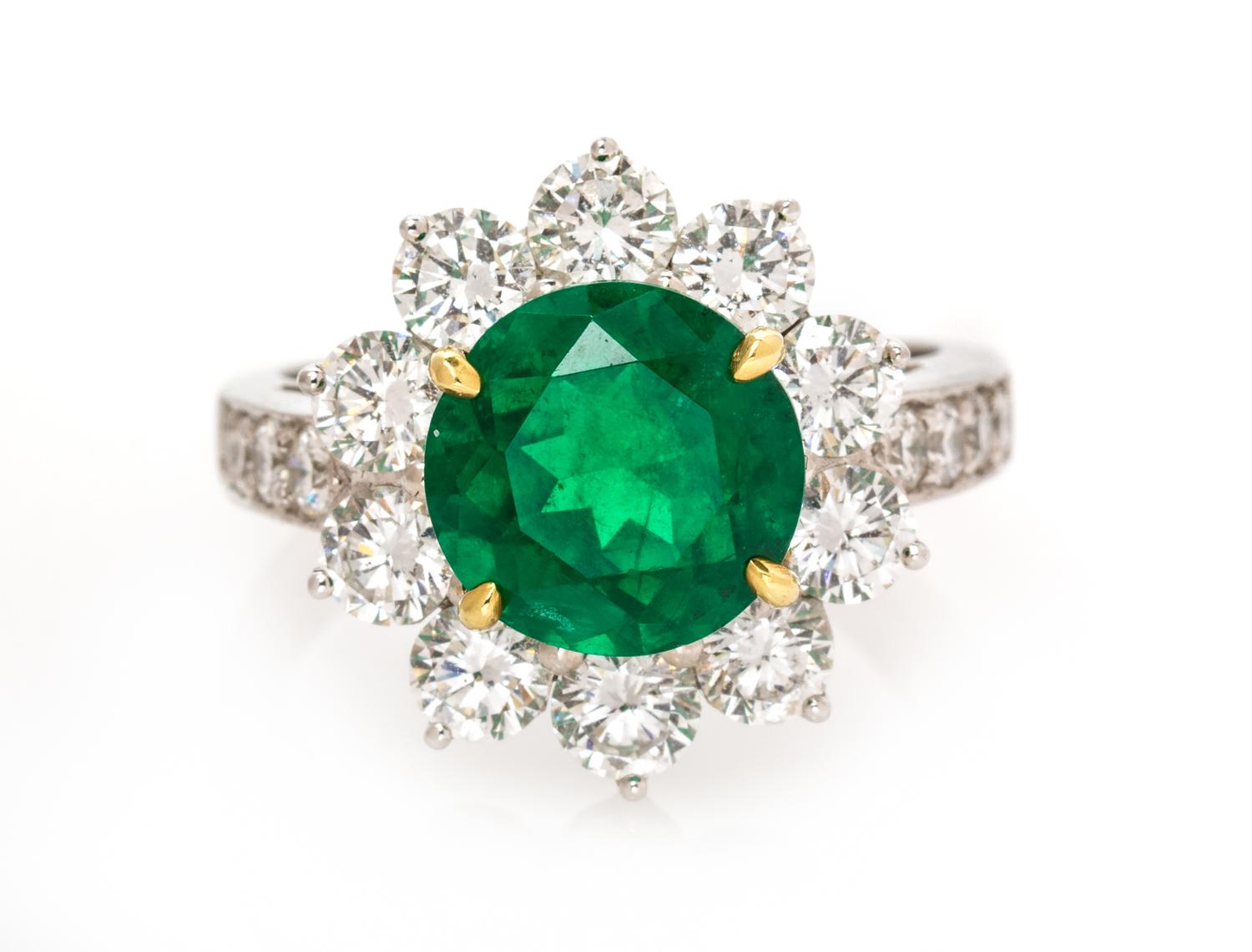 A Platinum, Yellow Gold, Emerald and Diamond Ring, 6.25 dwts.