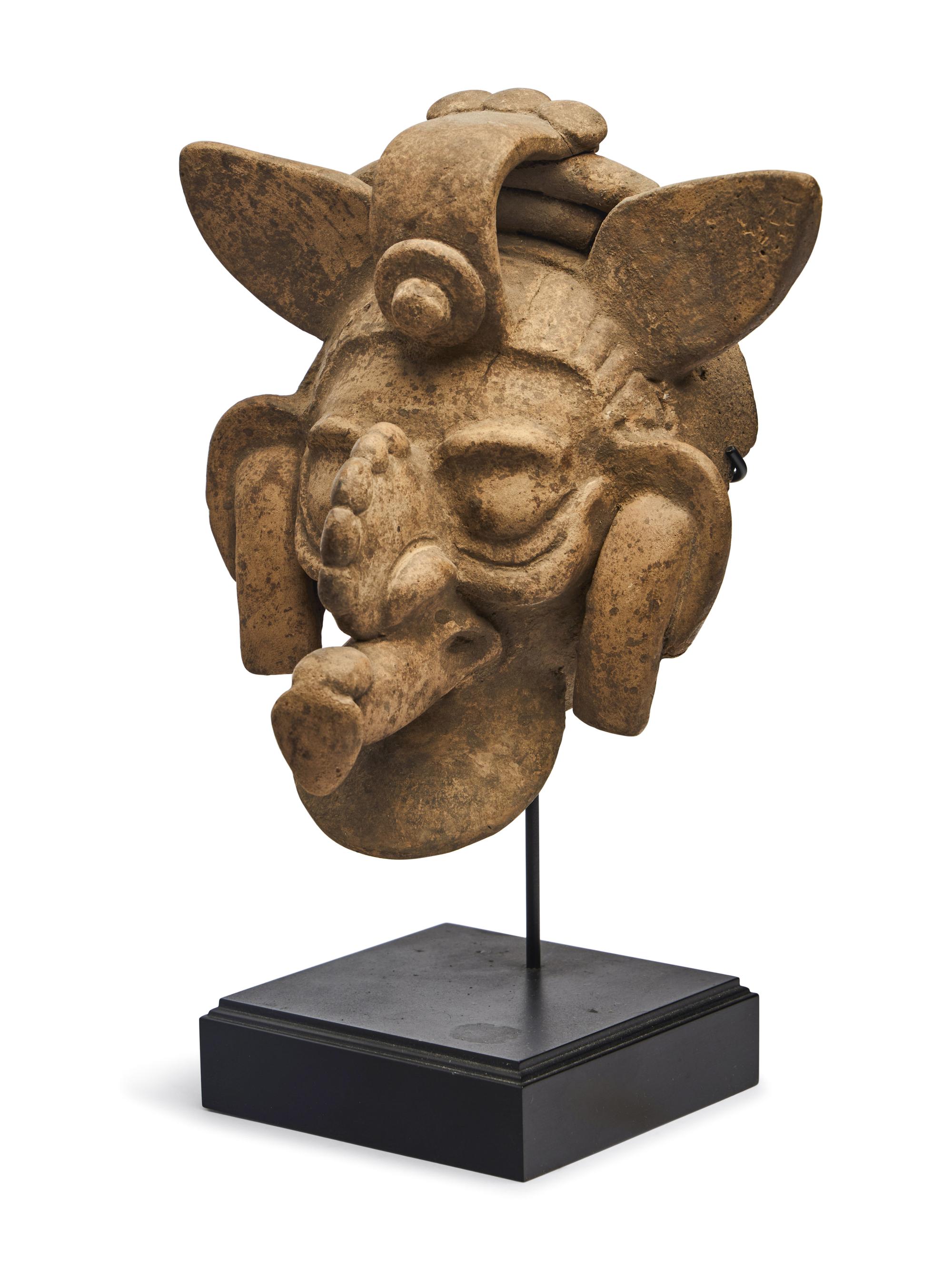 A Maya Polychrome Terracotta Head of a Deity