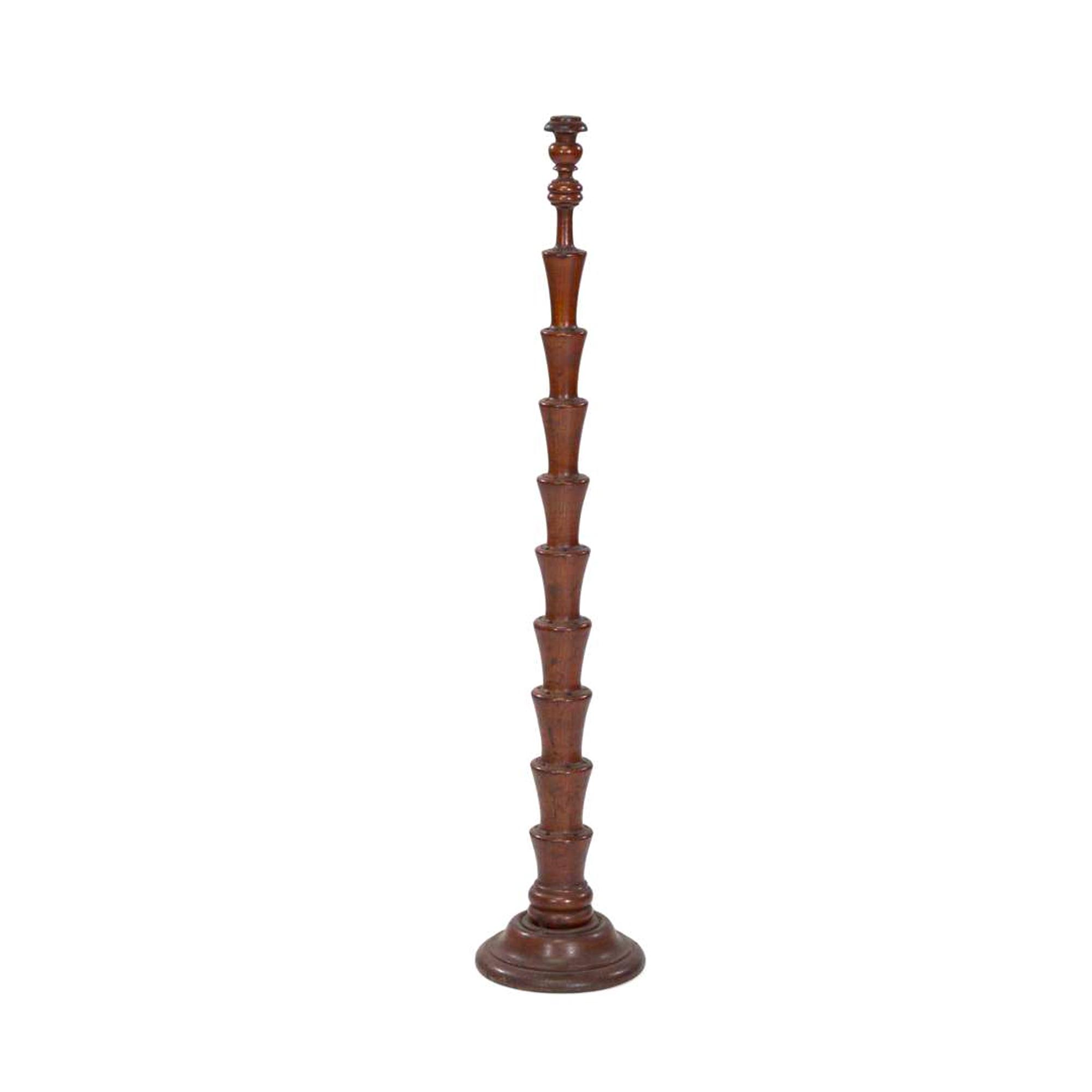 [FLAGS]. A turned wooden flag tree stand. Late 19th-early 20th century.