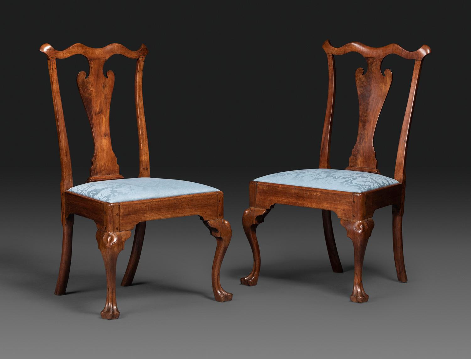A Pair of Queen Anne Carved Walnut Trifid Foot Side Chairs