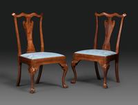 A Pair of Queen Anne Carved Walnut Trifid Foot Side Chairs