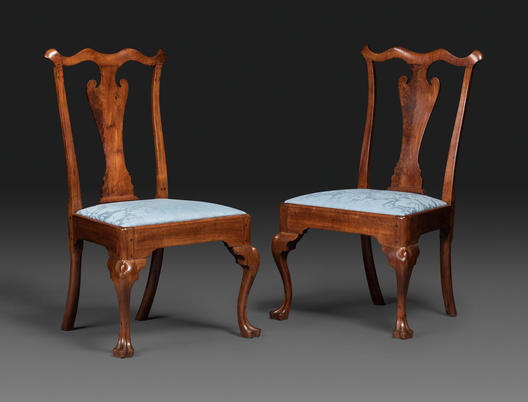 A Pair of Queen Anne Carved Walnut Trifid Foot Side Chairs