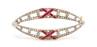 A Platinum Topped Yellow Gold, Diamond and Ruby Brooch, 3.60 dwts.