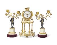 A Louis XVI Style Gilt and Patinated Bronze Mounted White Marble Three-Piece Clock Garniture