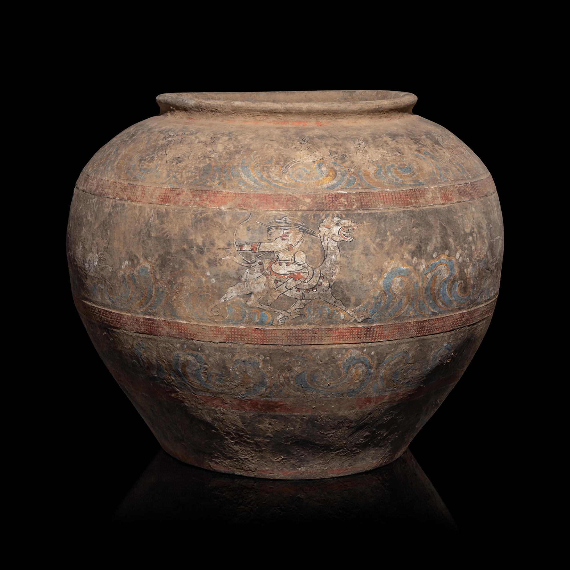 A Chinese Painted Pottery 'Mythical Beast' Jar, Han Dynasty — 漢 灰陶彩繪狩獵圖大罐
