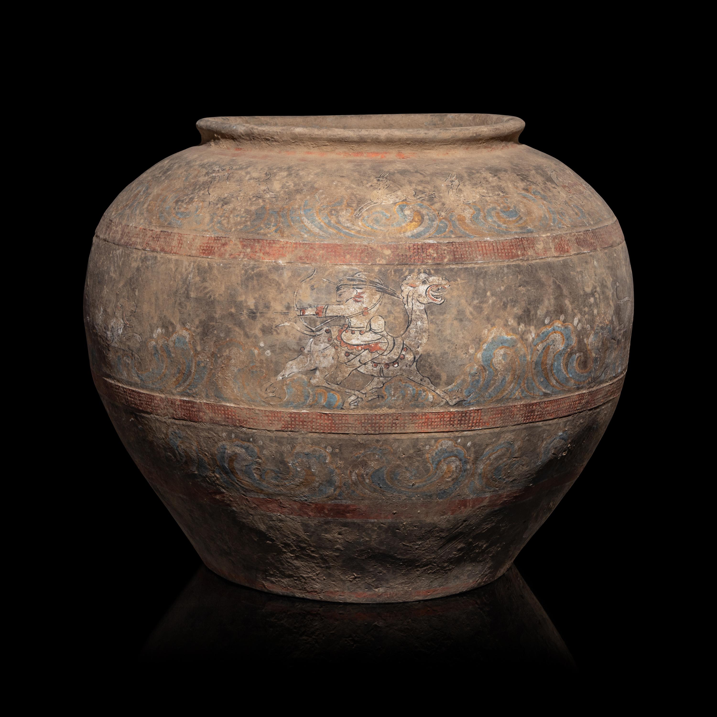 A Chinese Painted Pottery 'Mythical Beast' Jar, Han Dynasty — 漢 灰陶彩繪狩獵圖大罐
