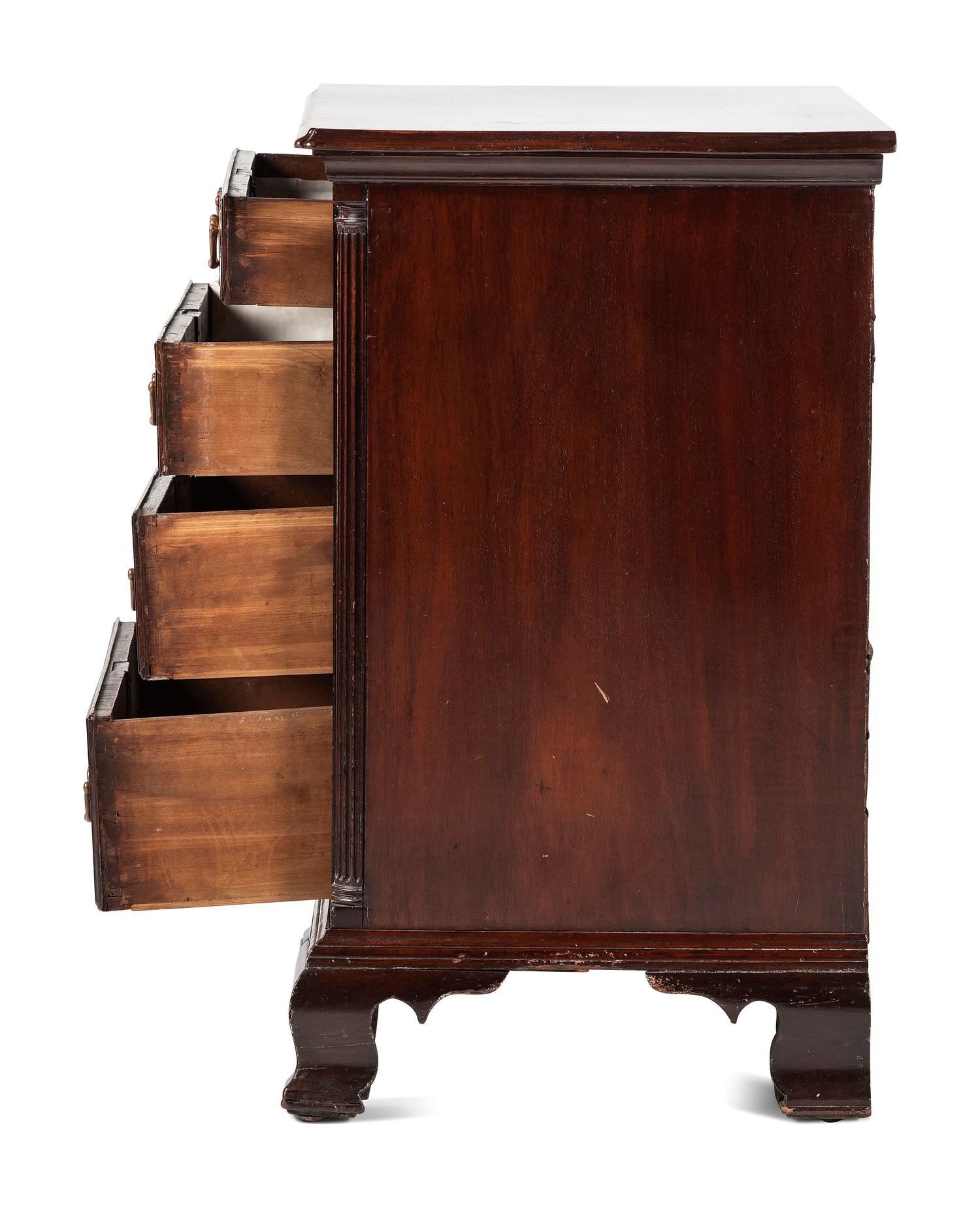 A Chippendale Carved and Figured Mahogany Chest of Drawers