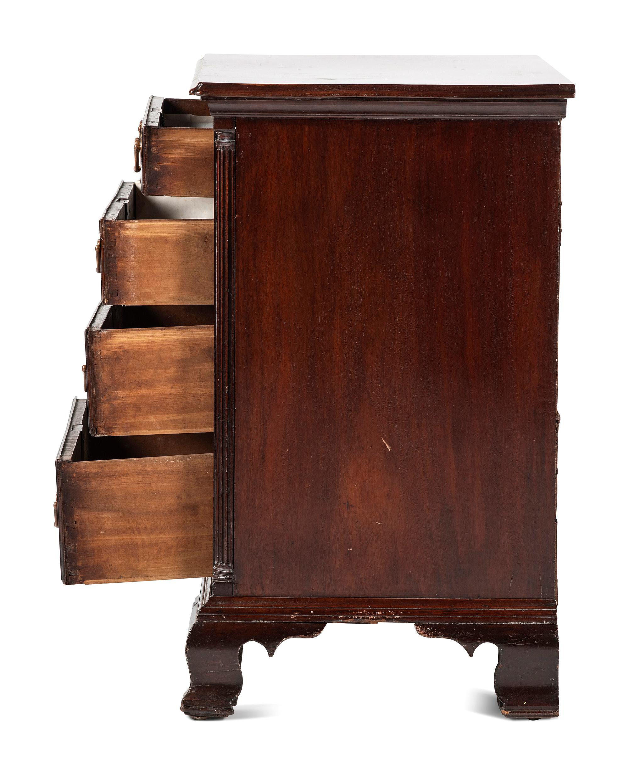 A Chippendale Carved and Figured Mahogany Chest of Drawers