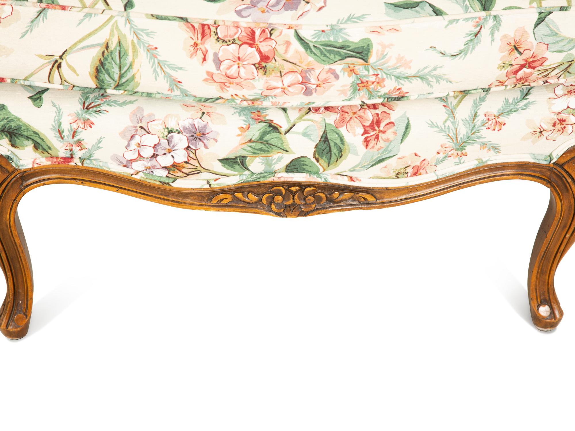 A Pair of Louis XV Style Walnut Bergères