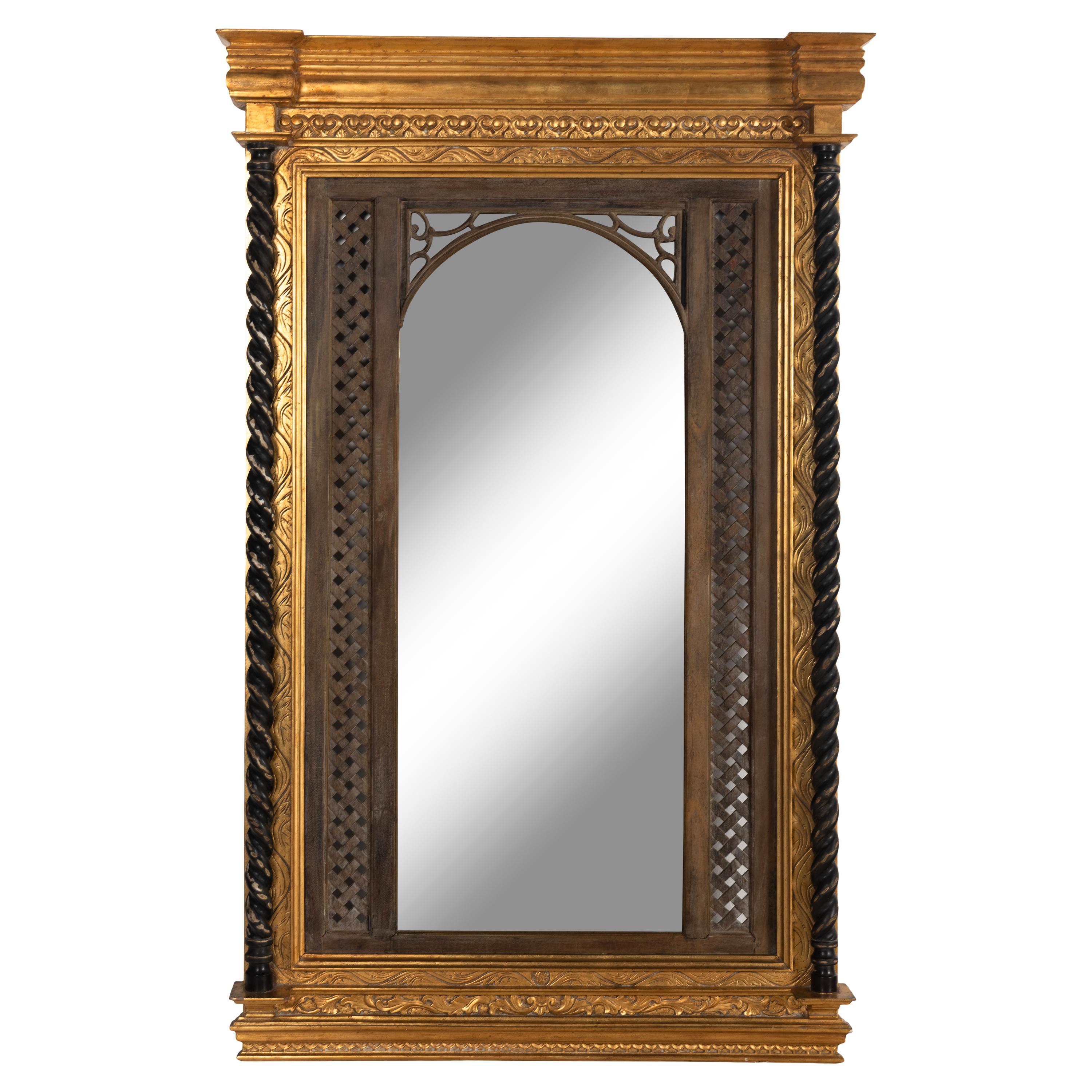A Southeast Asian Giltwood and Carved Teak Mirror